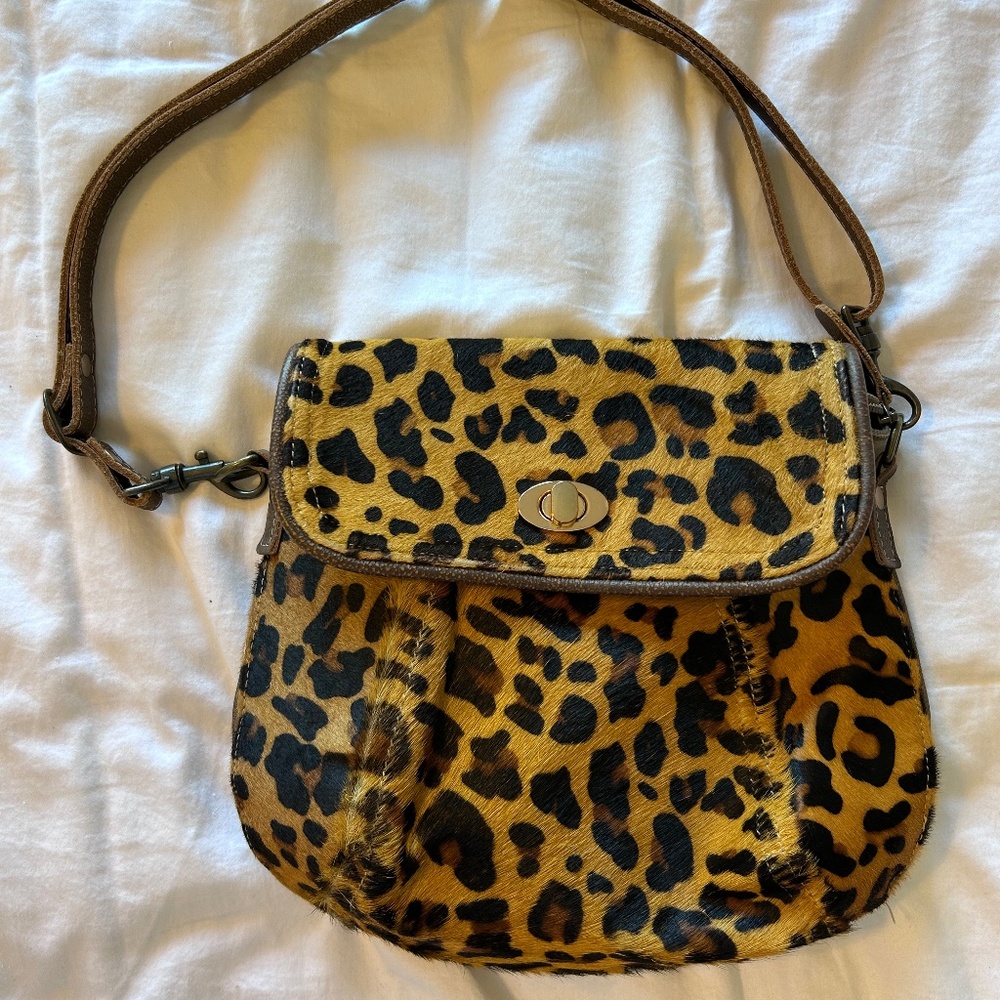 Maya Bag Leopard faux fur purse with adjustable strap.